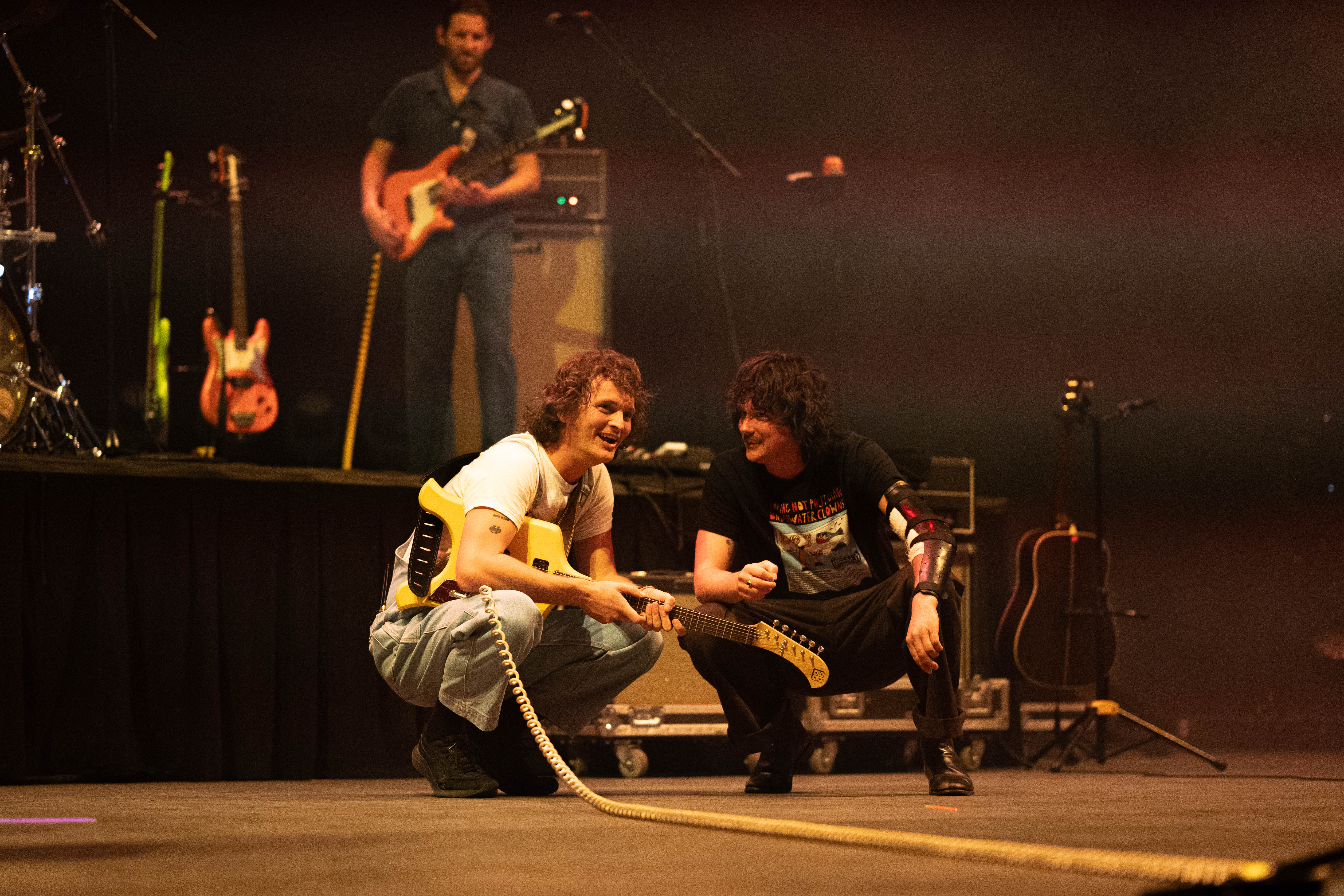 Vegas with Stu and Ambrose squatting and smiling